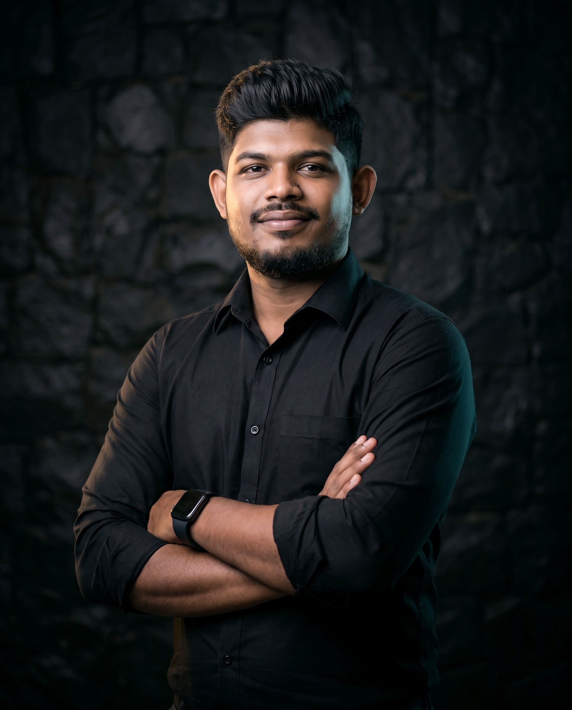 Ravindu Fernando, Application Security Consultant, arms folded, in a black shirt